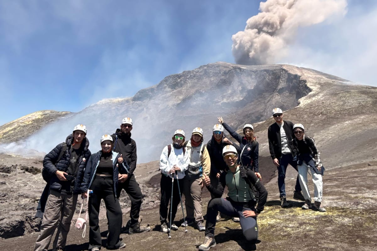 Hikers on the summit craters of Mount Etna